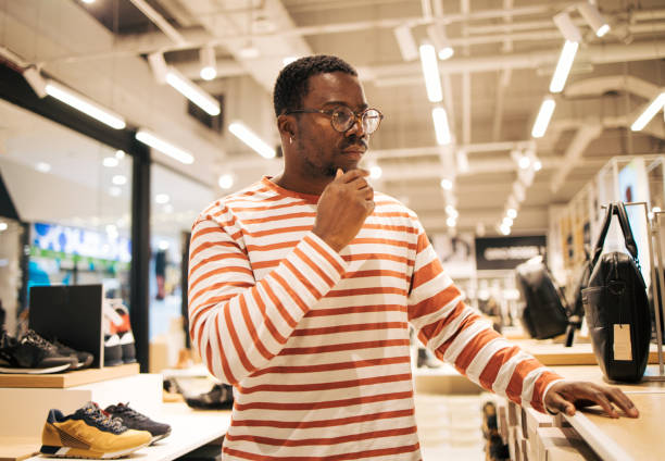 Young boy is thinking about what to buy